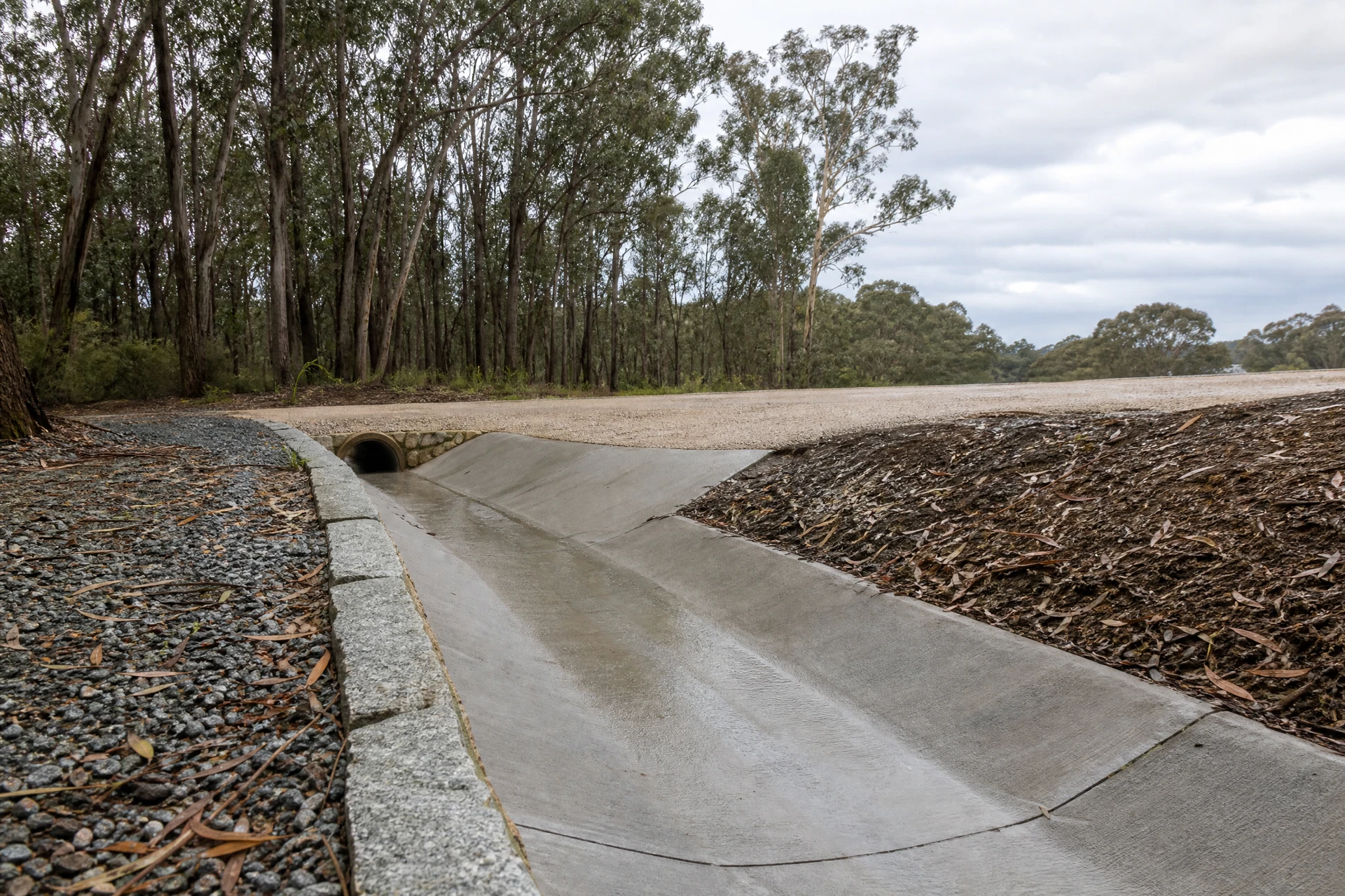 Roadside drainage correction beside a driveway crossover